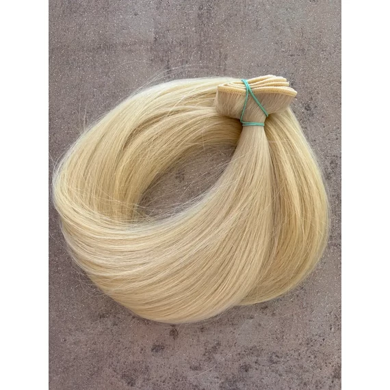 Enyhén hamvas platina szőke tresszelt 50cm 100% eredeti emberi haj/1gr